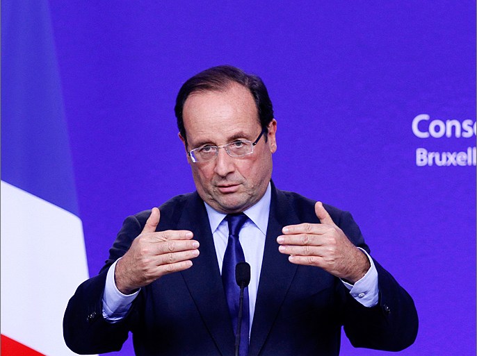 France's President Francois Hollande holds a news conference during a two-day European Union leaders summit in Brussels early June 29, 2012. EU leaders were still meeting in the night for their 20th summit since Europe's debt crisis began 2-1/2 years ago. REUTERS/Sebastien Pirlet (BELGIUM - Tags: POLITICS BUSINESS)