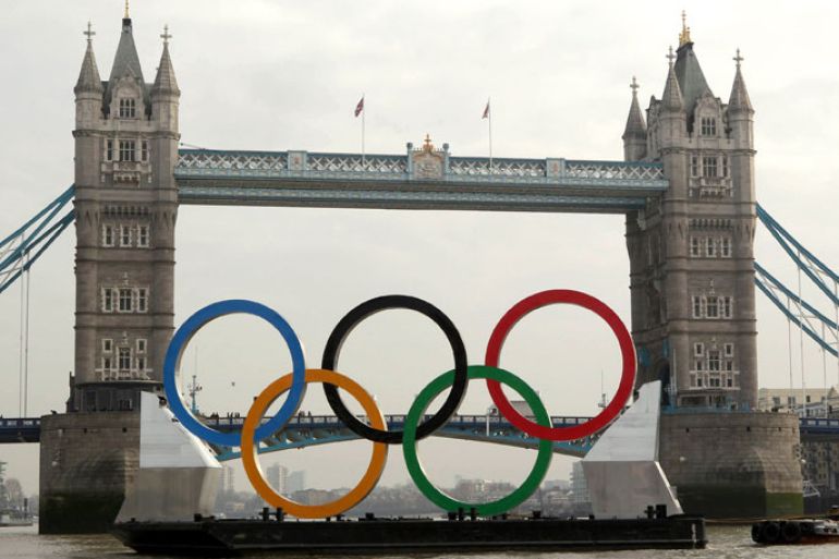 LONDON, ENGLAND - FEBRUARY 28: Giant Olympic rings are towed on The River Thames past Tower Bridge on February 28, 2012 in London, England. With 150 days remaining before the start of the London 2012 games the Olympic rings, measuring 11 metres high by 25 metres wide, are being showcased on the river as Mayor of London Boris Johnson announces details of two new cultural programmes, which will be part of the London 2012 Festival, along with details of other cultural events being organised to celebrate the London 2012 Olympic and Paralympic Games. (Photo by Peter Macdiarmid/Getty Images)