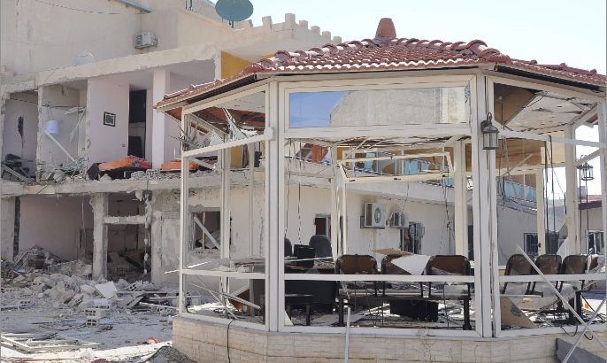 Damage is seen at the site of an attack on the pro-government Al-Ikhbariya satellite television channel's offices outside Damascus, which killed three staff on June 27, 2012 after President Bashar al-Assad said Syria was in a "state of war."