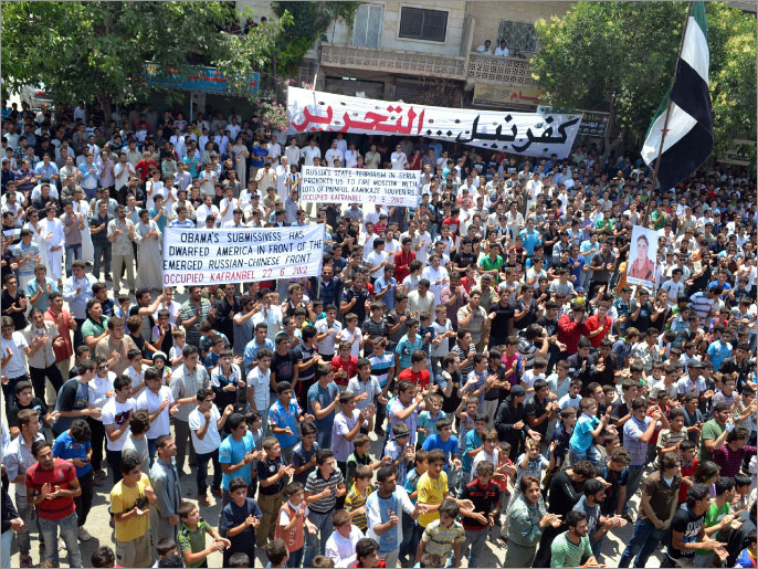 ‪‬ مظاهرة في كفر نبل بإدلب تطالب بسقوط النظام(الفرنسية-أرشيف)