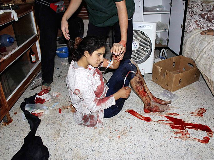 A girl wounded by shelling is treated at a makeshift hospital in Baba Amr neighbourhood of Homs June 23, 2012. Picture taken June 23, 2012. REUTERS/Nader Al Husseini/Shaam News Network/Handout (SYRIA - Tags: POLITICS CIVIL UNREST) FOR EDITORIAL USE ONLY. NOT FOR SALE FOR MARKETING OR ADVERTISING CAMPAIGNS. THIS IMAGE HAS BEEN SUPPLIED BY A THIRD PARTY. IT IS DISTRIBUTED, EXACTLY AS RECEIVED BY REUTERS, AS A SERVICE TO CLIENTS