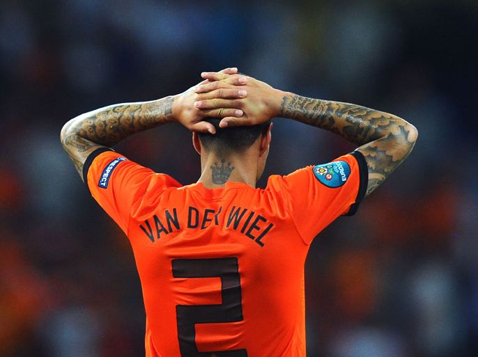 KHARKOV, UKRAINE - JUNE 13: Gregory van der Wiel of Netherlands puts his hands on his head at the final whistle during the UEFA EURO 2012 group B match between Netherlands and Germany at Metalist Stadium on June 13, 2012 in Kharkov, Ukraine. (Photo by Lars Baron/Getty Images)
