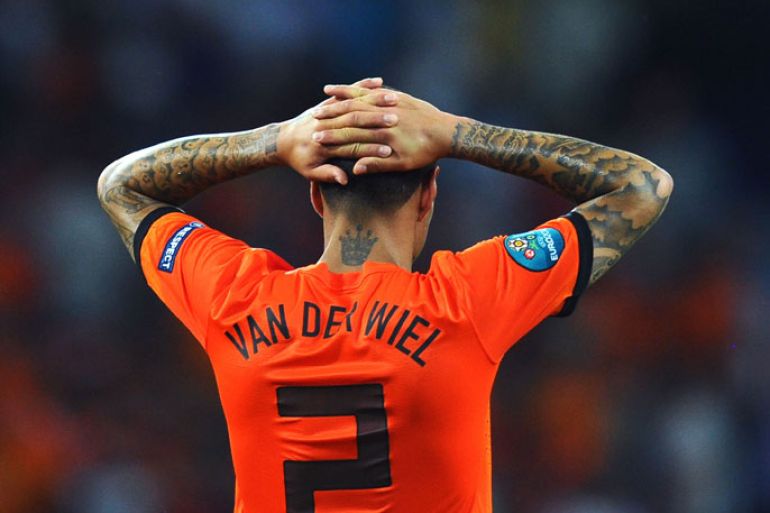 KHARKOV, UKRAINE - JUNE 13: Gregory van der Wiel of Netherlands puts his hands on his head at the final whistle during the UEFA EURO 2012 group B match between Netherlands and Germany at Metalist Stadium on June 13, 2012 in Kharkov, Ukraine. (Photo by Lars Baron/Getty Images)