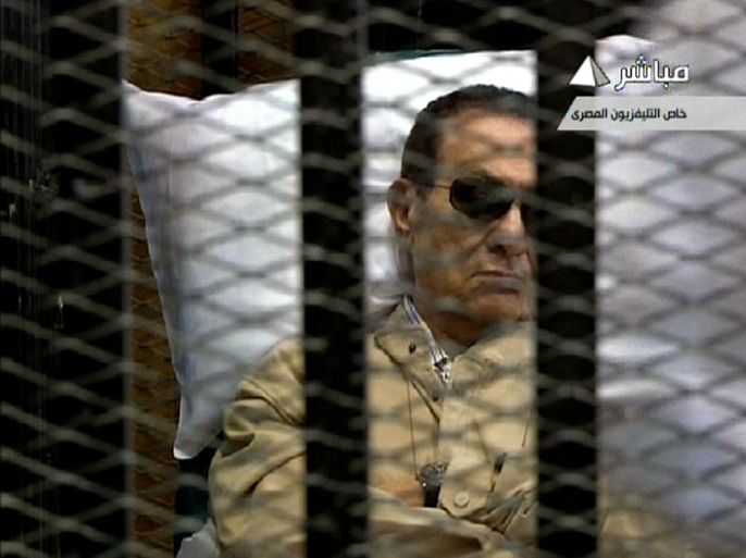 An image grab taken from Egyptian state TV shows ousted Egyptian president Hosni Mubarak sitting inside a cage in a courtroom during his verdict hearing in Cairo on June 2, 2012. Mubarak will learn whether he is guilty of the murder of demonstrators during the uprising that overthrew him last year. AFP
