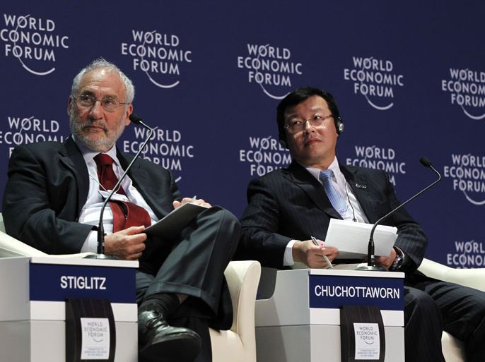 epa03244353 Joseph E. Stiglitz, Professor at Columbia University in the United States, (L) and Pailin Chuchottaworn, President and Chief Executive Officer of PTT Public Company, Thailand and Co-Chair of the World Economic Forum on East Asia, at a session on ASEAN connectivity and a roadmap to 2015, at the World Economic Forum on East Asia in Bangkok, Thailand, 01 June 2012. Hundreds of the world's business leaders attended the two day WEF session on East Asia in Bangkok to discuss Asia's position in the global economy.