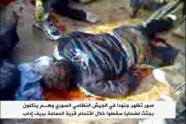 جنود الجيش النظامي السوري ينكلون بجثث مقيدة