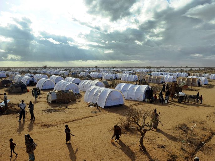 (FILES) This photo taken on July 31, 2011, shows Somali refugees walking in the new Ifo-extension at the Dadaab refugee camp in Kenya, the largest refugee camp in the world. Gunmen kidnapped four foreign aid workers and killed their driver on June 29, 2012, in Kenya's Dadaab refugee camp complex near the border with war-torn Somalia, police and officials said. The four, who work with the Norwegian Refugee Council (NRC), come from Canada, Norway, Pakistan and the Philippines, regional police official Philip Ndolo told AFP.