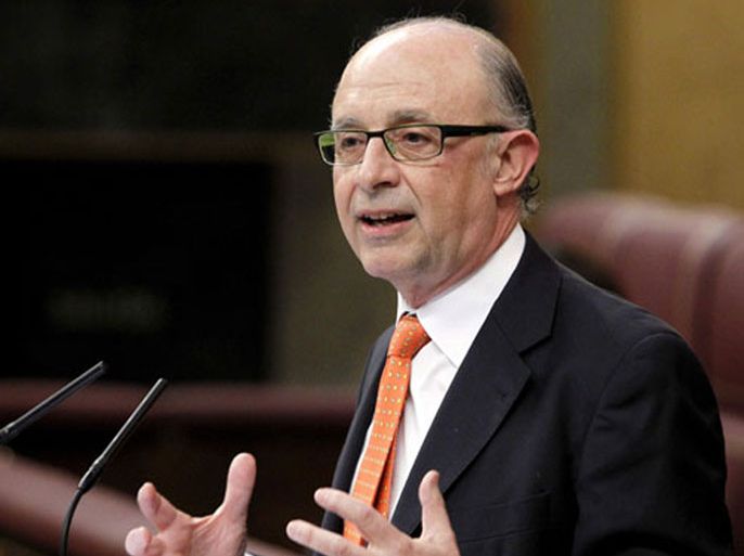 epa03143203 Spanish Treasury and Public Administration Minister, Cristobal Montoro, gestures during his speech at the Spanish Parliament in Madrid, Spain, 13 March 2012. In order to fit the Eurogroup demand, most of the additional cuts heading to get a 5.3 per cent budget deficit