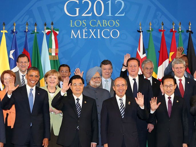 epa03272406 Leaders of the world's leading economies wave at the convention center in the Pacific resort of Los Cabos, Mexico, on 18 June 2012, as they