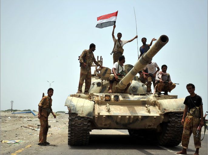 epa03264695 Yemeni soldiers stand on a tank after the army forces retook control of southern towns from al-Qaeda militants at Zinjibar town in Abyan province, Yemen, 14 June 2012. According to media reports, Yemeni warplanes stroke al-Qaeda militants' hideouts in south Yemen, killing at least 27 militants including leading figures. The Yemeni army regained control of the two main strongholds of al-Qaeda militants in Zinjibar and Jaar towns, nearly a year after they were occupied by the militants. EPA/YAHYA ARHAB