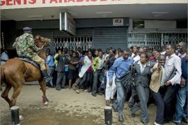 A policeman on a horse tries to control a crowd after a blast in central Nairobi on Moi Avenue on May 28, 2012. A blast ripped through a small shopping complex in central Nairobi and left at least 20 people wounded. Police sources confirmed several people were wounded and said they were investigating whether the blast was a bomb or an accident. The blast was powerful enough to rip the tin roof off the building and smash windows across the street. Kenya has been hit by a wave of grenade attacks the police have repeatedly blamed on Somalia's Al-Qaeda linked Shebab insurgents or its supporters