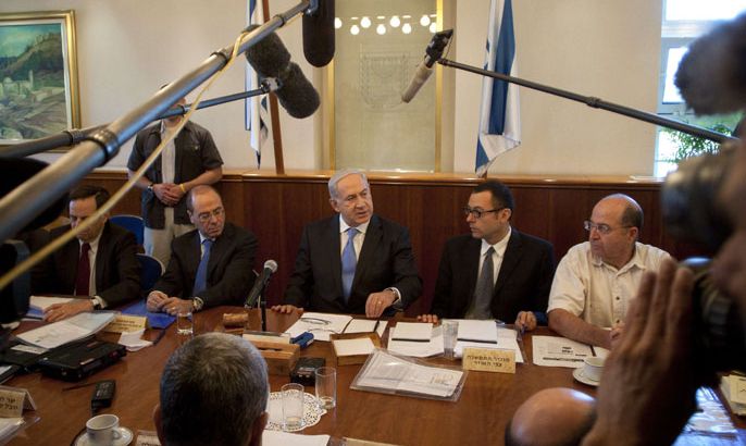 Israeli Prime Minister Benjamin Netanyahu (C) addresses the weekly cabinet meeting in Jerusalem on June 24, 2012. Netanyahu said troops had responded "forcefully" to rocket fire from the Gaza Strip and could boost their response if a fragile truce announced on June 23 failed to hold. AFP
