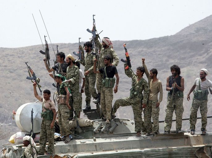 A handout image made available by the Yemeni Ministry of Defense on June 13, 2012, shows Yemeni soldiers celebrating after the army seized the Al-Qaeda strongholds of Jaar and the provincial capital Zinjibar on June 12, more than a year after the jihadists captured most of the Abyan province. Al-Qaeda militants had overrun most of the southern province early last year, taking advantage of the weakening of the central government by Arab Spring-inspired protests in the major cities. AFP PHOTO/HO/YEMENI MINISTRY OF DEFENCE/HO == RESTRICTED TO EDITORIAL USE - MANDATORY CREDIT "AFP PHOTO / YEMENI MINISTRY OF DEFENCE " - NO MARKETING NO ADVERTISING CAMPAIGNS - DISTRIBUTED AS A SERVICE TO CLIENTS