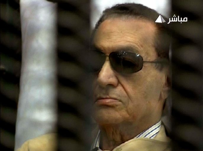 An image grab taken from Egyptian state TV shows ousted Egyptian president Hosni Mubarak sitting inside a cage in a courtroom during his verdict hearing in Cairo on June 2, 2012. Mubarak will learn whether he is guilty of the murder of demonstrators during the uprising that overthrew him last year. AFP