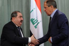 Russian Foreign Minister Sergei Lavrov (R) and his visiting Iraq's counterpart Hoshyar Zebari shake hands during their joint press conference in Moscow, on June 15, 2012. AFP PHOTO / KIRILL KUDRYAVTSEV