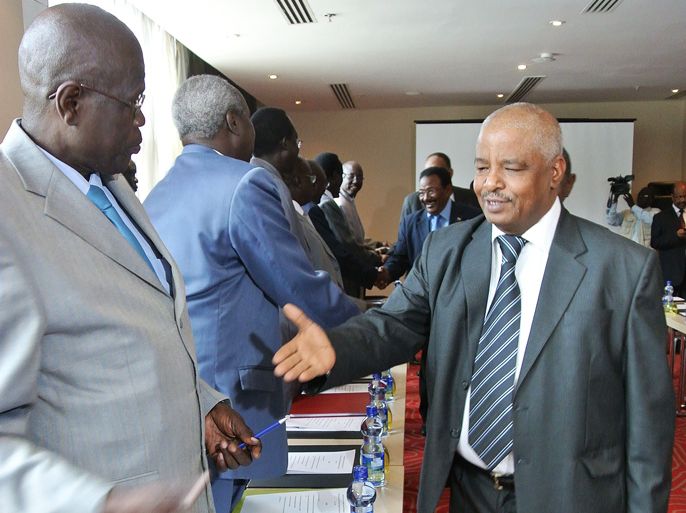 A member of Sudan’s negotiating team (R) greets a South Sudanese counterpart on June 4, 2012 at the opening of border security talks between Sudan and South Sudan in Addis Ababa. Delegations from the two countries, including the ministers of defense from both sides, are in the Ethiopian capital for the first face to face talks to discuss border security issues following weeks of fighting along the disputed border that brought the foes back to the brink of war. A May 2, 2012, United Nations report called for a swift resolution on a number of outstanding disputes between Khartoum and Juba, including border demarcation and how to split oil revenues. AFP