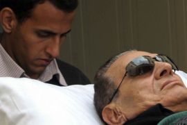 EGYPT (FILES) -- A file picture taken on January 5, 2012 shows Egypt's ousted president Hosni Mubarak being wheeled on a stretcher into a court for his trial in Cairo on January 5, 2012.