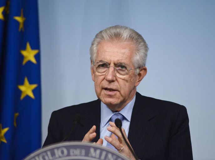 epa03255215 Italian Prime Minister Mario Monti speaks to journalists during a