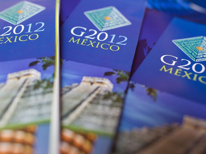 epa03270069 G20-brochures seen in the press center in Las Cabos, Mexico, 17 June 2012. This year's G20 summit will take place in the exclusive seaside resort on 18 and 19 June 2012. The Mexican presidency of the G20 has set economic stabilization, financial system strengthening, international financial architecture reform, food security and green growth as its top priorities for the summit. The summit will also see Obama's first meeting with Russian President Vladimir Putin since Putin returned to that office this year. EPA/PEER GRIMM