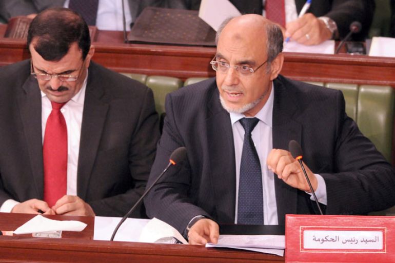 TUNISIA : Tunisian Prime Minister Hamadi Jebali (R) gives a speech at the Tunisian Constituent Assembly on June 29, 2012 in Tunis. Jenali criticized the "contempt" of those who accuse Libya of "not respecting human rights", justifying in front of the Constituent Assembly his decision to extradite the former Libyan Prime Minister Mahmoudi. AFP PHOTO / KHALIL