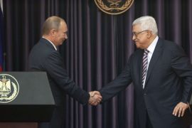 Palestinian Authority President Mahmud Abbas (R) and Russia's President Vladimir Putin shake hands at a joint news conference in the West Bank Biblical town of Bethlehem on June 26, 2012, during a rare trip aimed at boosting Russia's regional role. AFP