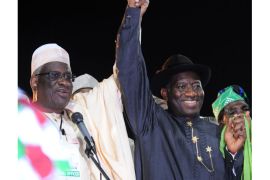 This photo taken on January 14, 2011, in Abuja, shows Defence Minister Bello Mohammed (L) raising the hand of then national chairman of the ruling People's Democratic Party (PDP) and presidential candidate Goodluck Jonathan during a campaign rally. On June 22, 2012