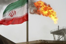 Gas flares from an oil production platform at the Soroush oil fields in the Persian Gulf, 1,250 km (776 miles) south of the capital Tehran in this July 25, 2005 file photo. Iran's top crude buyers in Asia have just weeks to come up with ways, which have proved elusive so far, to keep the imports flowing without falling foul of the toughest Western sanctions to date against Tehran's oil trade, reported June 6, 2012. Picture taken July 25, 2005. To match Analysis IRAN-OIL/ASIA REUTERS/Raheb Homavandi/Files (IRAN - Tags: ENERGY BUSINESS)