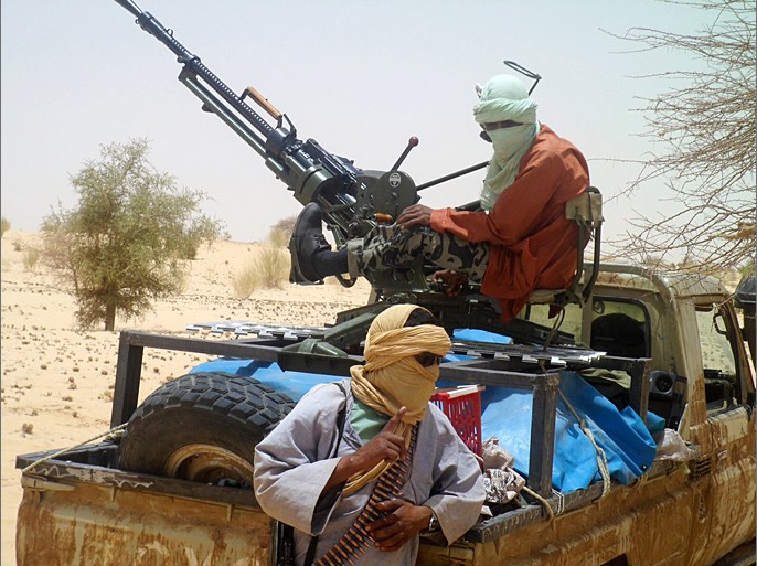 MALI : A picture taken on April 24, 2012 shows Islamists rebels of Ansar Dine near Timbuktu, in rebel-held northern Mali. Islamist and Tuareg rebels clashed in the key town of Gao in Mali's occupied north, leaving at least 20 people dead, witnesses said on June 27, 2012. AFP PHOTO / ROMARIC OLLO HIEN