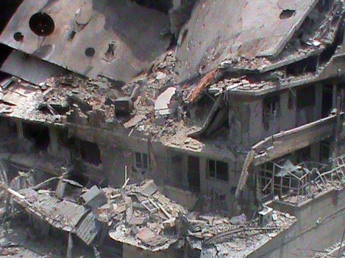 - Homs, -, SYRIA : A handout image released by the Syrian opposition's Shaam News Network shows destruction in the al-Qusur neighbourhood of Homs on June 21, 2012