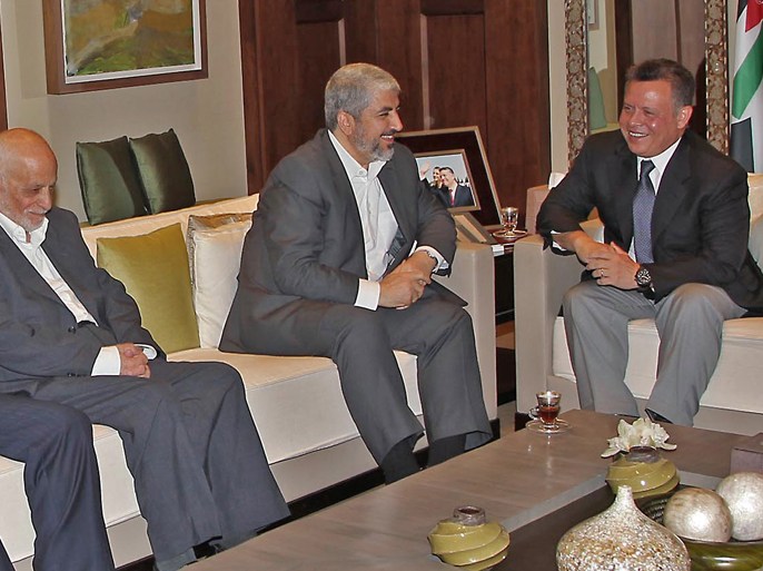 A handout picture released by the Jordanian Royal Palace shows Jordan's King Abdullah (L) shaking hands with Hamas chief Khaled Meshaal during their meeting in Amman on June 28, 2012. This is Meshaal's second visit to Jordan this year to boost ties with the kingdom. AFP