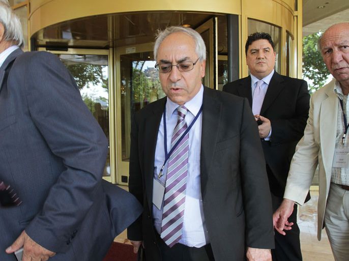 leader of the Syrian National Council (SNC), Abdel Basset Sayda (2nd-L), leaves after a meeting at the Conrad Hotel in Istanbul on June 15, 2012. Syrian opposition leaders were meeting in Turkey today in a bid to settle their differences and forge a united front to confront the escalating conflict in their homeland. The Istanbul meeting groups almost all opposition factions, while representatives from several Arab and Western countries were also present as observers, along with a representative of international Syria envoy Kofi Annan