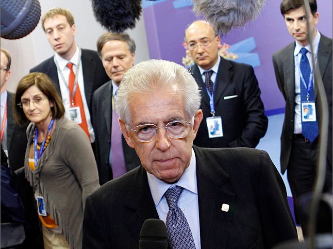 Italy's Prime Minister Mario Monti attends an interview as he leaves a two-day European Union leaders summit in Brussels early June 29, 2012. REUTERS/Sebastien Pirlet (BELGIUM - Tags: POLITICS BUSINESS)