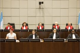 (Second row, L-R) Judges I.Nosworthy, M. Braidi, Robert Roth, D. Re and W.Akoum of the UN Special Tribunal for Lebanon attend the opening of the public hearing in the assassination case of former Lebanese prime minister Rafiq Hariri, at the court in Leidschendam, near The Hague, on June 13, 2012. Lebanon's special UN-backed tribunal hears arguments by defence teams who are challenging the court's legitimacy to try their clients -- four Hezbollah members accused of murdering former prime minister Rafiq Hariri in 2005. AFP PHOTO / POOL / ROBERT VOS POOL ***NETHERLANDS OUT***