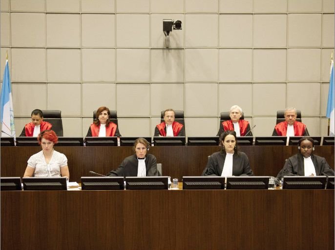 (Second row, L-R) Judges I.Nosworthy, M. Braidi, Robert Roth, D. Re and W.Akoum of the UN Special Tribunal for Lebanon attend the opening of the public hearing in the assassination case of former Lebanese prime minister Rafiq Hariri, at the court in Leidschendam, near The Hague, on June 13, 2012. Lebanon's special UN-backed tribunal hears arguments by defence teams who are challenging the court's legitimacy to try their clients -- four Hezbollah members accused of murdering former prime minister Rafiq Hariri in 2005. AFP PHOTO / POOL / ROBERT VOS POOL ***NETHERLANDS OUT***