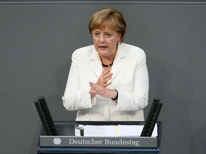 IW978 - Berlin, Berlin, GERMANY : German Chancellor Angela Merkel addresses German lawmakers before they vote on the EU fiscal pact and permanent ESM bailout fund, at the lower Bundestag house of parliament in Berlin on June 29, 2012. The 620 members of the Bundestag will vote on the EU fiscal pact which commits Germany and its partners to more budgetary discipline and on the creation of the ESM, the permanent rescue fund which is to take over starting next month from the European Financial Stability Facility (EFSF). AFP PHOTO / ADAM BERRY