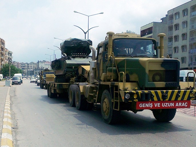 Turkish military trucks carry missile batteries on June 28, 2012 in the center of Hatay. Turkey is sending missile batteries and army vehicles to the border with Syria as a "security corridor", almost a week after the Syrian downing of a Turkish military jet, media reports said. There was no official confirmation of the reported military moves. About 30 military vehicles accompanied by a truck towing missile batteries left a base in the southeastern province of Hatay for the border, about 50 kilometres (30 miles) away, the Milliyet newspaper reported. AFP