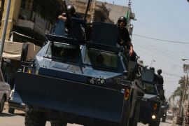 Lebanese army armored vehicles patrol in Tripoli's Sunni neighbourhood of Bab al-Tabbaneh on June 3, 2012. New clashes broke out between pro- and anti-Syrian regime gunmen in the northern Lebanese city of Tripoli despite the deployment of the army, a security official said. AFP PHOTO