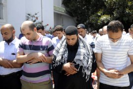 Tunisians pray on June 15, 2012 in front of the Fath mosquee in Tunis during Friday prayers. Public security in Tunisia was "normal throughout the country" ahead of Friday prayers, after which several religious groups had planned protest rallies, an interior ministry spokesman said