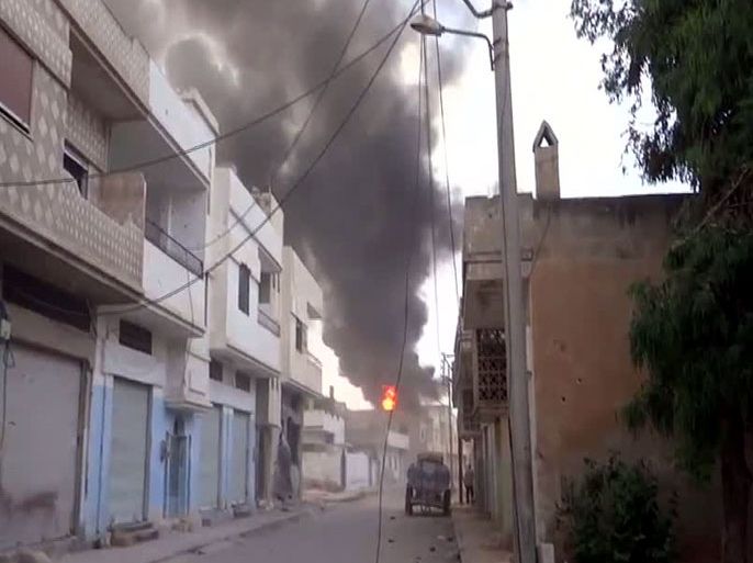 An image grab taken from a video uploaded on YouTube on June 15, 2012 allegedly shows smoke and fire billowing from a house after mortar shelling by government forces in the city of Talbisseh in the flashpoint province of Homs. US President Barack Obama and his Russian counterpart Vladimir Putin will discuss differences over what to do about the conflict in Syria at a G20 summit next week, a top US official said. AFP