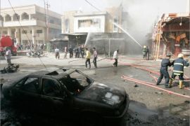 Firefighters hose down a damaged building after a car bomb attack in Kirkuk, 250 km (155 miles) north of Baghdad, June 20, 2012. A car bomb exploded on Wednesday in the centre of Iraq's northern oil-rich city of Kirkuk, killing three civilians and wounding nine others, police sources in the city said. They said that the blast targeted a passing convoy of judge Aziz Abdul Qader just metres away from Kirkuk courthouse in the centre of Kirkuk. Judge Aziz and two of his bodyguards were wounded in the blast that damaged the judge vehicle and police vehicle escorting the convoy, police said. REUTERS/Ako Rasheed (IRAQ - Tags: CONFLICT)
