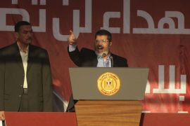 EGYPT : Egypt's Islamist president-elect Mohamed Morsi addresses tens of thousands of Egyptians in Cairo's iconic Tahrir Square on June 29, 2012. Morsi paid tribute to Egypt's Muslims and Christians alike and symbolically swore himself in as the country's first elected civilian president