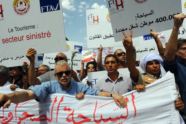 FB1685 - Tunis, -, TUNISIA : Tunisian employees of the tourism industry shout slogans during a demostration to defend the sector on June 16, 2012 in Tunis. Around 200 hoteliers, employees of travel agencies and tour operators have responded to the call of the Tunisian tourism industry associations to demand a strong response to the violence of the authorities earlier this week. AFP PHOTO / KHALIL