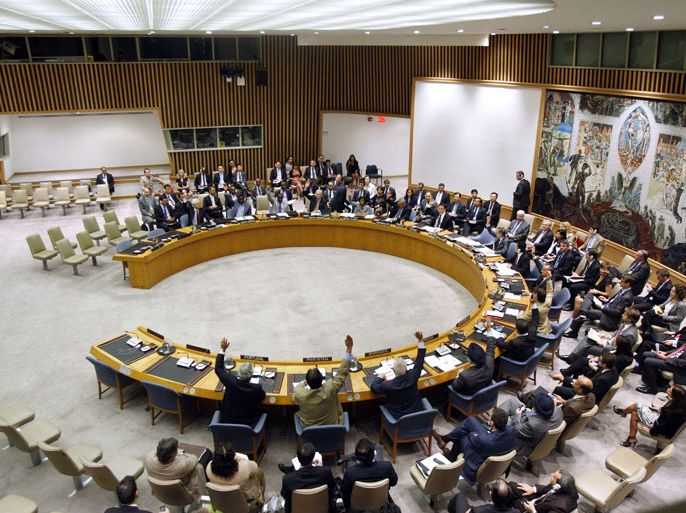 MANDATORY CREDIT " AFP PHOTO / UNITED NATIONS/" -- This United Nations photo shows the UN Security Council voting to extend Syrian mission mandate on July 20, 2012. The Security Council unanimously voted to let the UN observer mission in Syria stay for a "final" 30 days, but remained