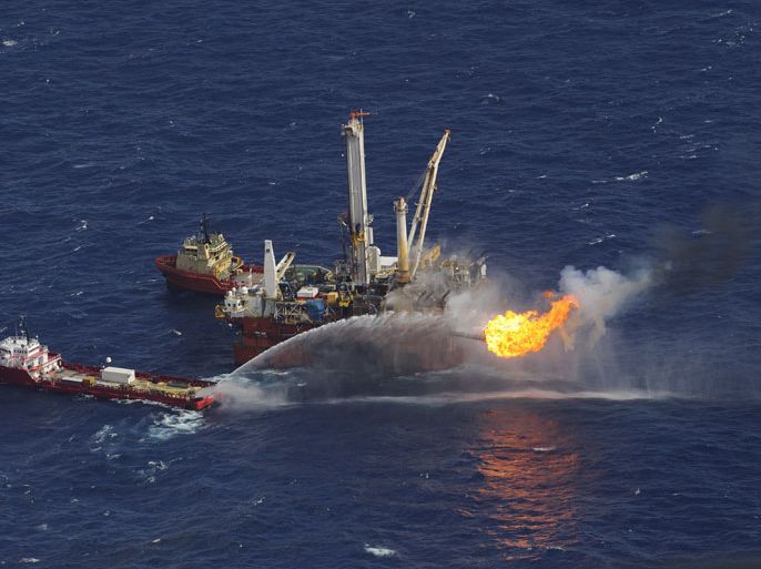 epa02894899 (FILE) A file photograph showing the oil rig Q4000 at the site of the BP Deepwater Horizon oil well spill site in the Gulf of Mexico off the coast of Louisiana, USA 03 July 2010. Reports state on 02 September 2011 that US energy services giant Halliburton is suing British Petroluem (BP) for defamation and negligent misrepresentation over the disastrous 2010 oil spill in the Gulf of Mexico. Halliburton claims BP allgedly gave inaccurate information to the US company before it did work lining the well with cement. EPA/BOB PEARSON
