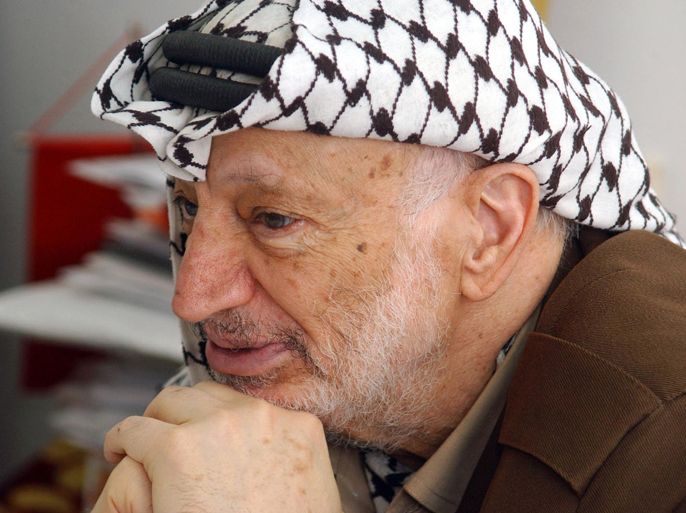 (FILES) -- A file handout picture dated April 21, 2004 and made available by the Palestinian Press Office (PPO) shows Palestinian leader Yasser Arafat at his office in the West Bank city of Ramallah. Arafat, who died in 2004, was poisoned by polonium, according to the findings of laboratory research carried out in Switzerland and cited in an Al-Jazeera report on July 3, 2012. AFP