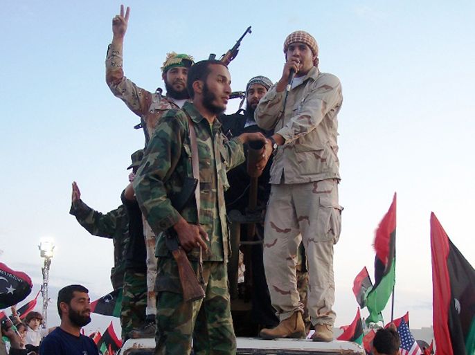صورة أرشيفية لمجموعة من الثوار المحسوبين على التيار الإسلامي المتشدد يوم إعلان تحرير ليبيا،والتعليق كالتالي: مقعد واحد نصيب الجهاديين الليبيين في المؤتمر الوطني ( الجزيرة نت).