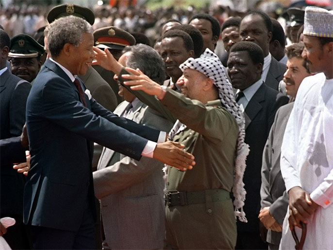 South African anti-apartheid leader and African National Congress (ANC) member Nelson Mandela (L) warmly greets Palestine Liberation Organization (PLO) chairman Yasser Arafat on his arrival in Lusaka, 27 February 1990. It's the first visit of Nelson Mandela to a foreign country since his recent release from jail. He is in Zambia to attend a meeting of ANC National Executive Committee.