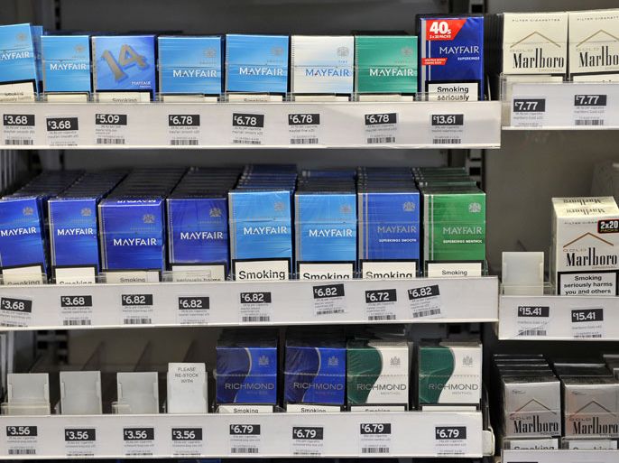 Tobacco on shelves at a store in London, Britain, 06 April 2012. A ban on tobacco displays comes into force in England on 06 April. Cigarettes will have to be kept below the counter in large shops and supermarkets. The ban will impact smaller stores from 2015. EPA/ANDY RAIN