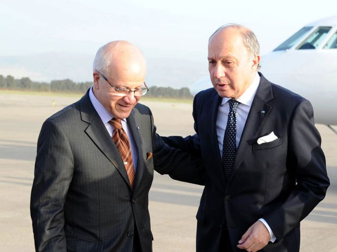 FAR01 - Algiers, -, ALGERIA : French Foreign Minister Laurent Fabius (R) is welcomed by Algerian Foreign Minister Mourad Medelci upon his arrival at the Houari-boumediene airport in Algiers on July 15, 2012. Fabius is in Algeria on his first official trip to an Arab country, with the political crisis in neighbouring Mali featuring high on the agenda AFP PHOTO / FAROUK BATICHE