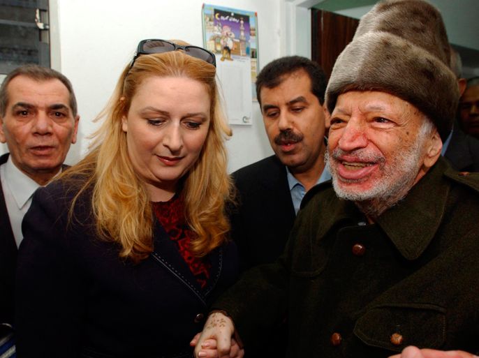 Assisted by his wife Suha (2nd L) and two aides, Palestinian President Yasser Arafat (R) leaves his West Bank office in Ramallah before flying to France, in this file photo provided to Reuters on October 29, 2004. Arafat's widow will launch a court case in France into the unexplained death of the iconic Palestinian leader eight years ago after a media report suggested he may have been poisoned, her lawyer said on July 10, 2012. REUTERS
